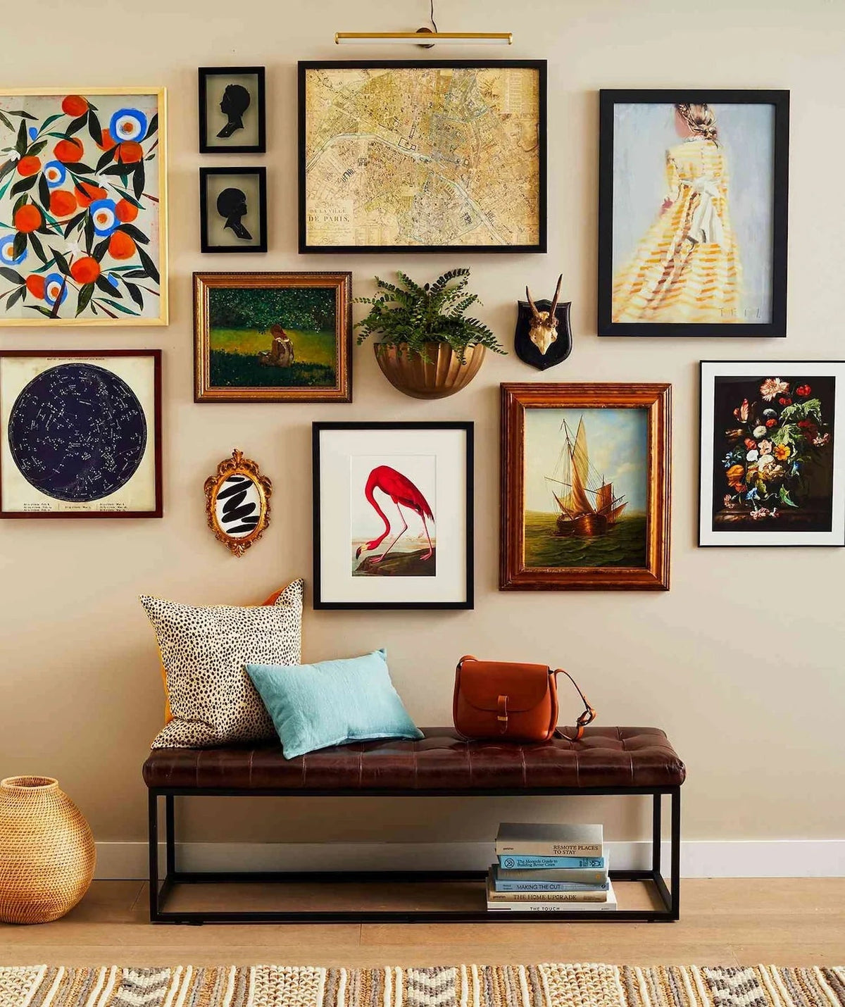 Gallery wall with framed artwork above a bench, inspiring last-minute holiday gift ideas for art lovers.