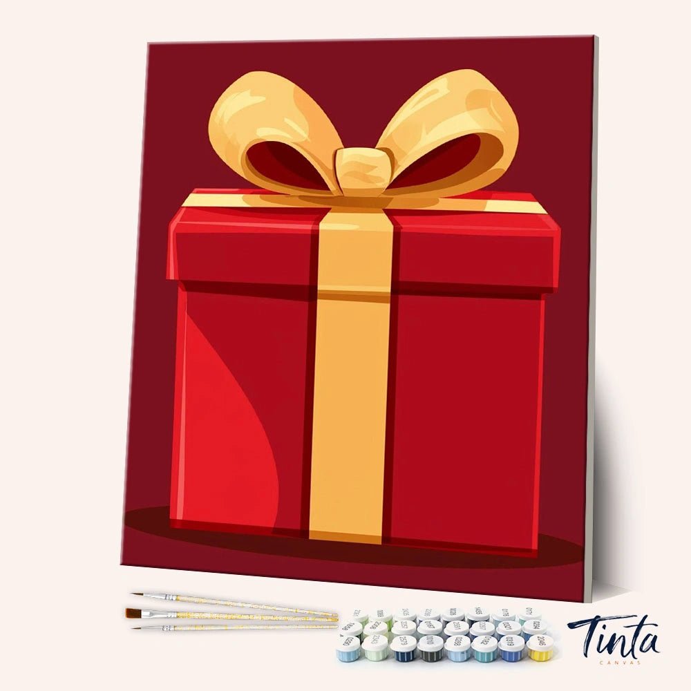 A Thoughtful Gift paint by numbers kit angled view showing red gift box with golden ribbon by Tinta Canvas