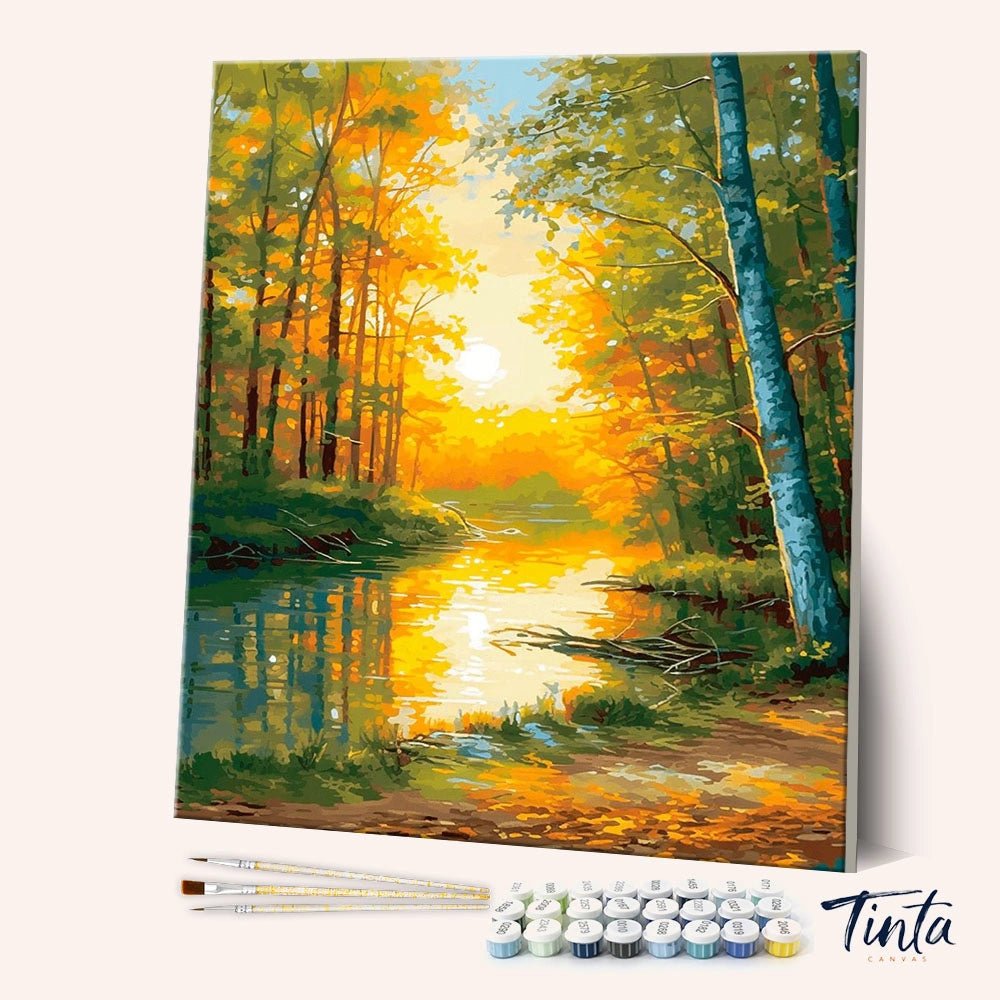 Autumnal Reflections paint by numbers kit angled view showing golden sunset over forest river by Tinta Canvas