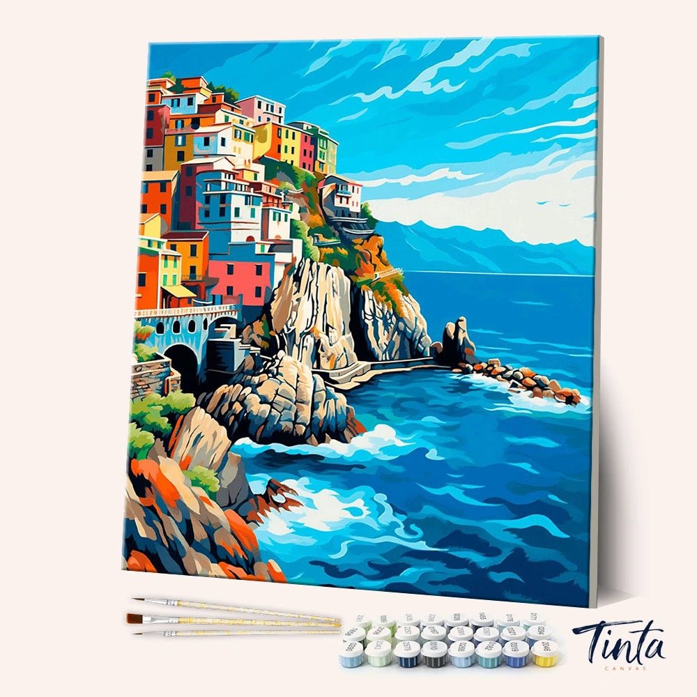 Blue Harbor Serenity paint by numbers kit angled view showing calm harbor with boats and colorful coastal buildings