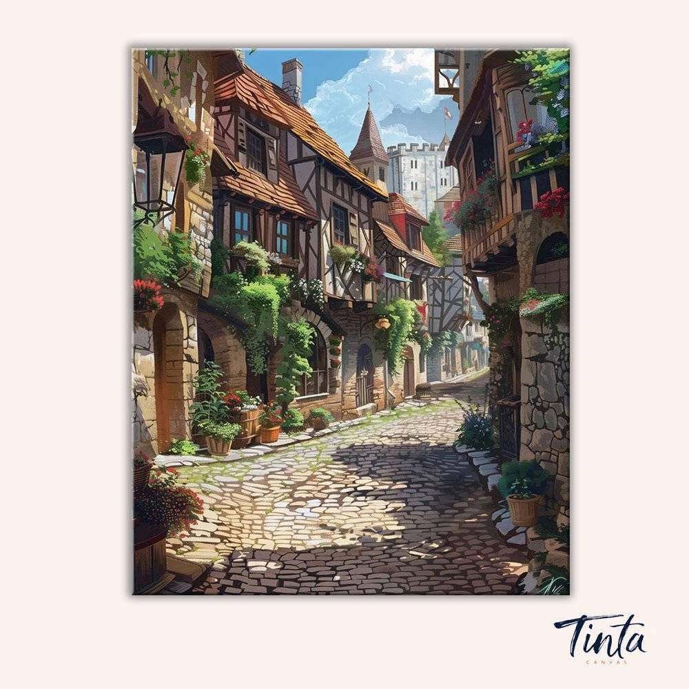 Cobblestone Morning paint by numbers kit artwork featuring a peaceful old town street with stone paths and rustic homes by Tinta Canvas