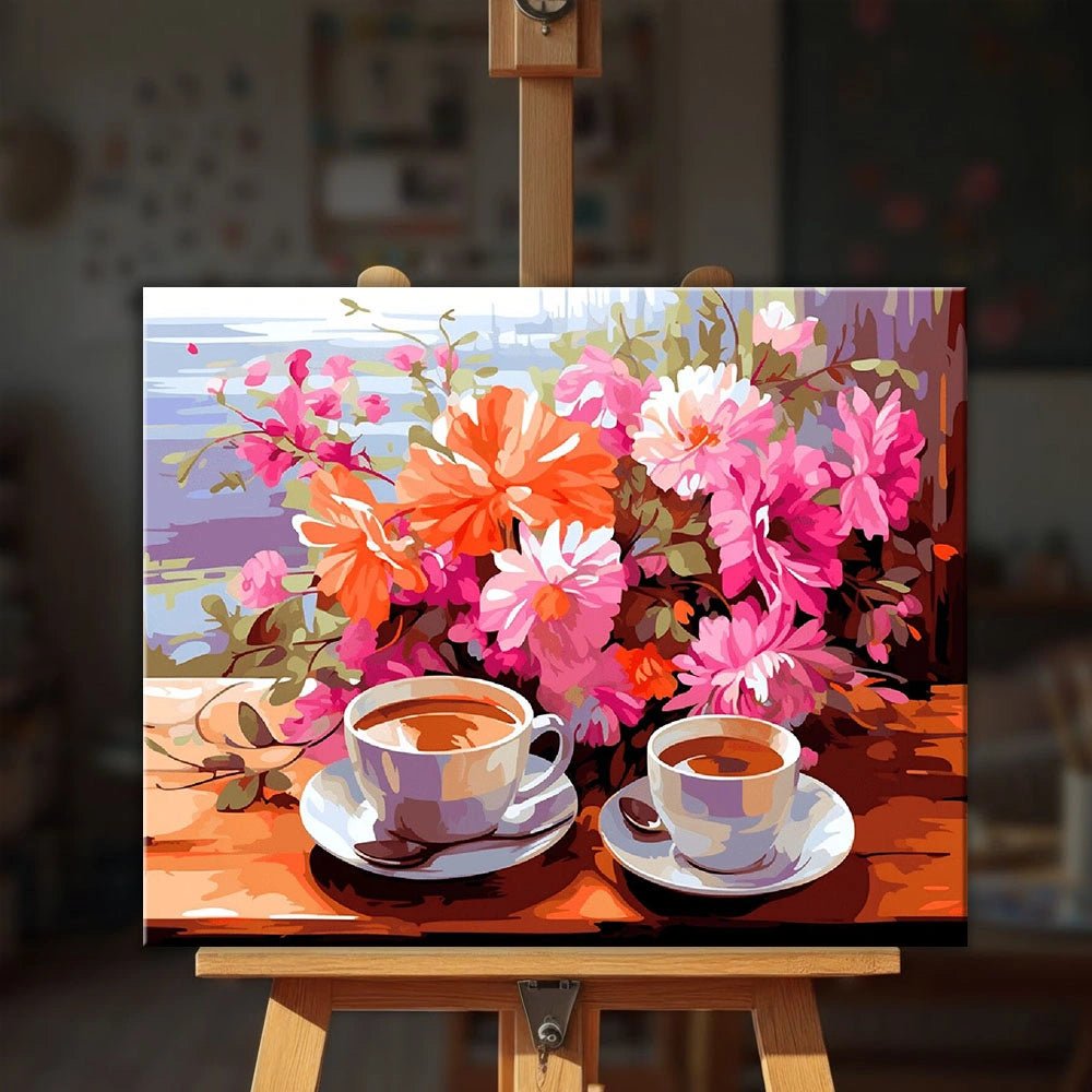 Coffee in Bloom paint by numbers kit displayed on easel featuring warm coffee cups and a vibrant bouquet of flowers by Tinta Canvas