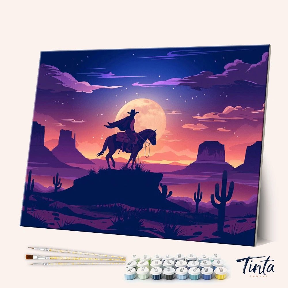 Cowboy Moonlight Ride paint by numbers kit shown in angled view with cowboy silhouette under glowing full moon
