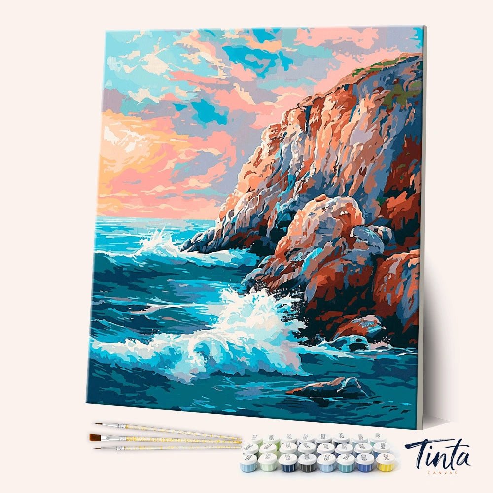 Angled view of Crashing Tide Cliffs paint by numbers kit featuring bold ocean waves and rocky shoreline by Tinta Canvas