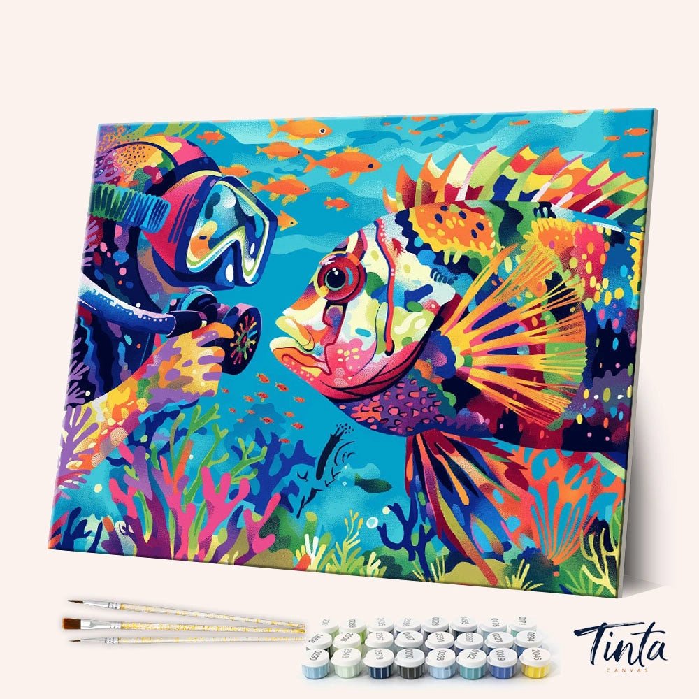 Angled display of the Curious Encounter paint by numbers kit showing a diver meeting a vibrant tropical fish underwater by Tinta Canvas