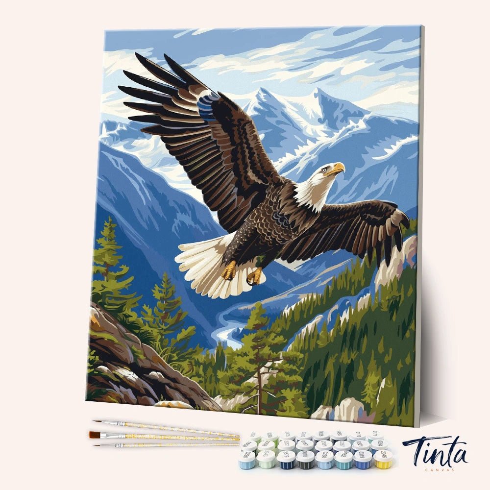Eagle Flight paint by numbers kit showing a majestic eagle soaring above alpine mountains by Tinta Canvas
