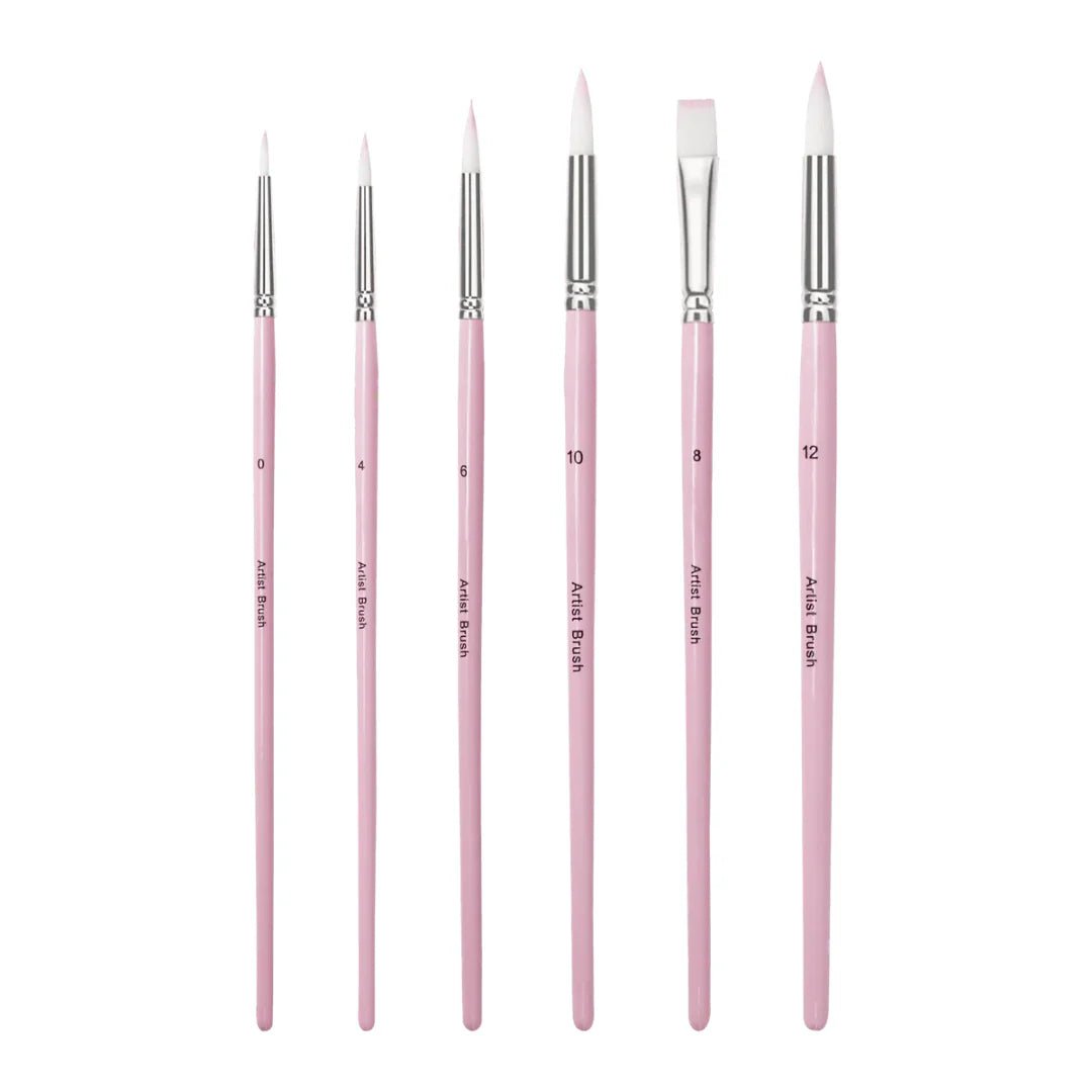 Set of pink painting brushes with silver ferrules on a white background