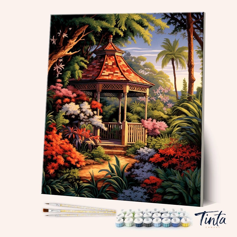 Angled view of Garden Pavilion Retreat paint by numbers kit featuring a red roof gazebo in lush garden by Tinta Canvas