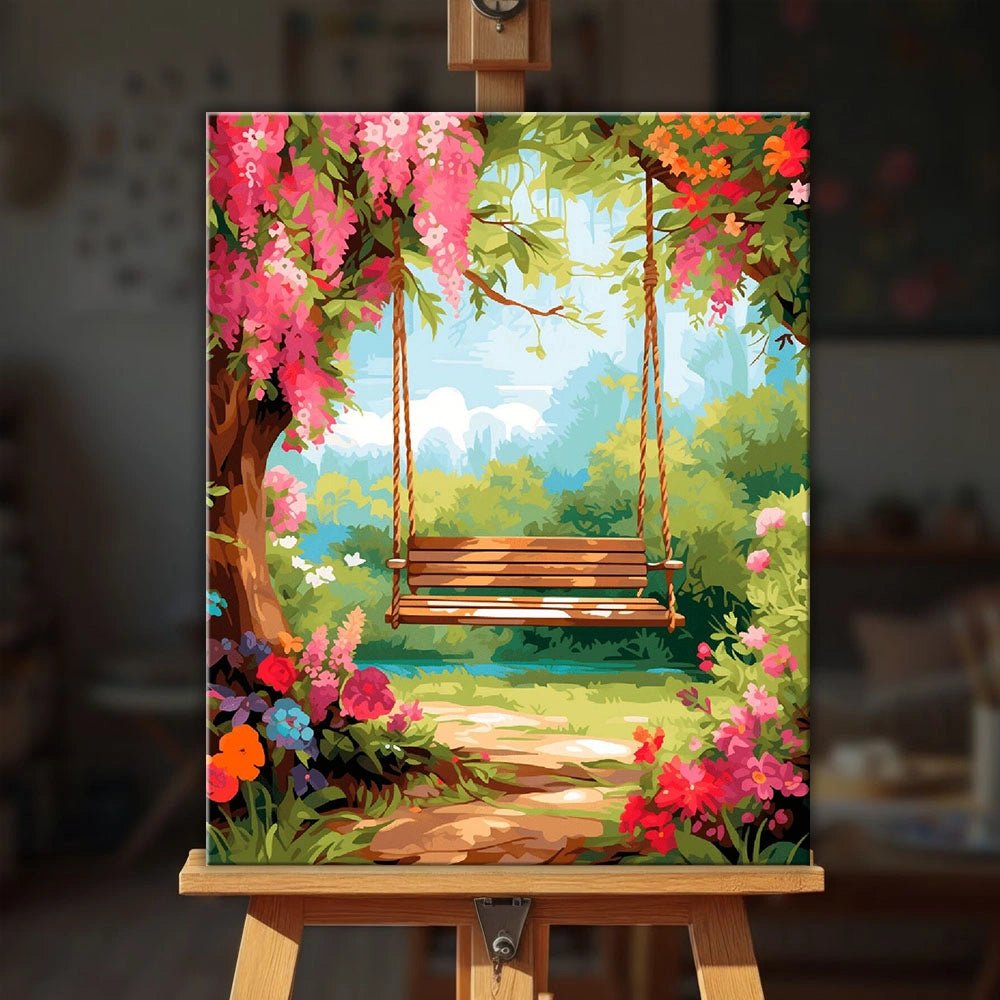 Garden Swing Daydream paint by numbers kit displayed on an easel showing a relaxing garden swing scene with lush flowers by Tinta Canvas