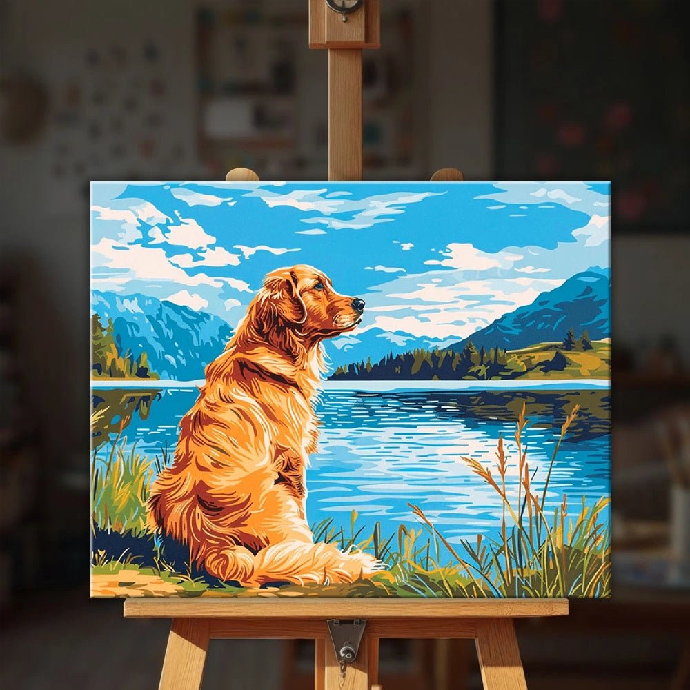 Golden Lake Watch paint by numbers kit displayed on an easel in a cozy interior setting showing finished dog lake painting by Tinta Canvas