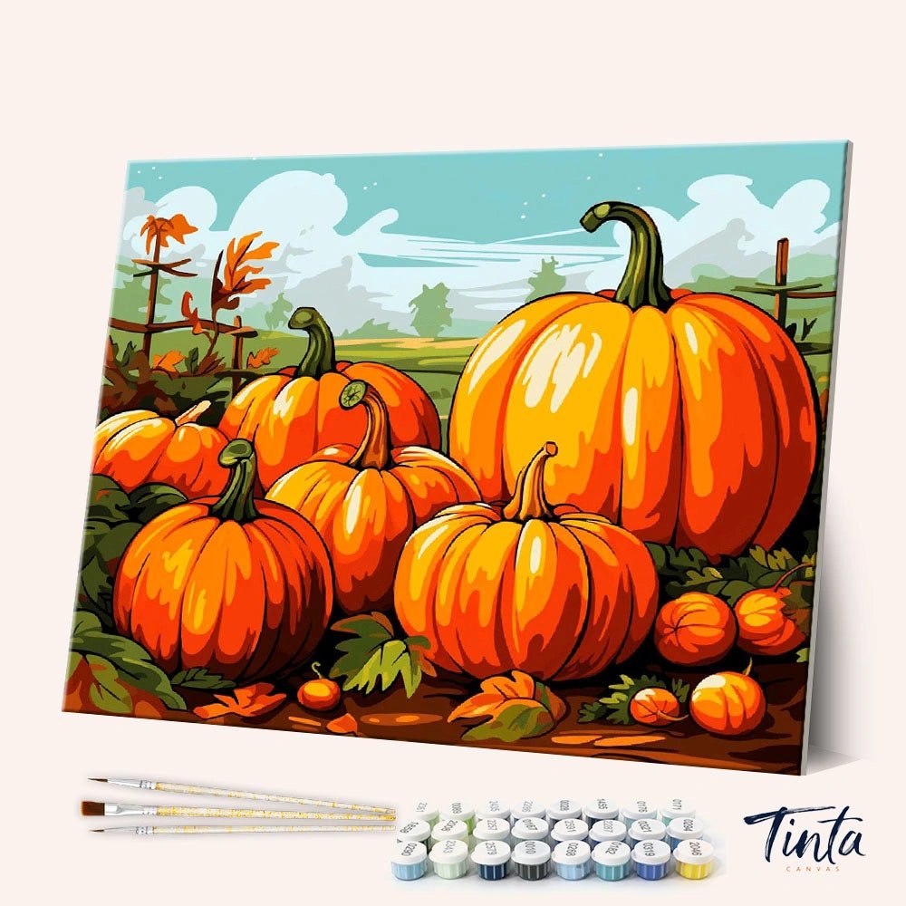 Angled view of Harvest Pumpkins paint by numbers kit showing bright orange pumpkins in autumn field with tools included by Tinta Canvas
