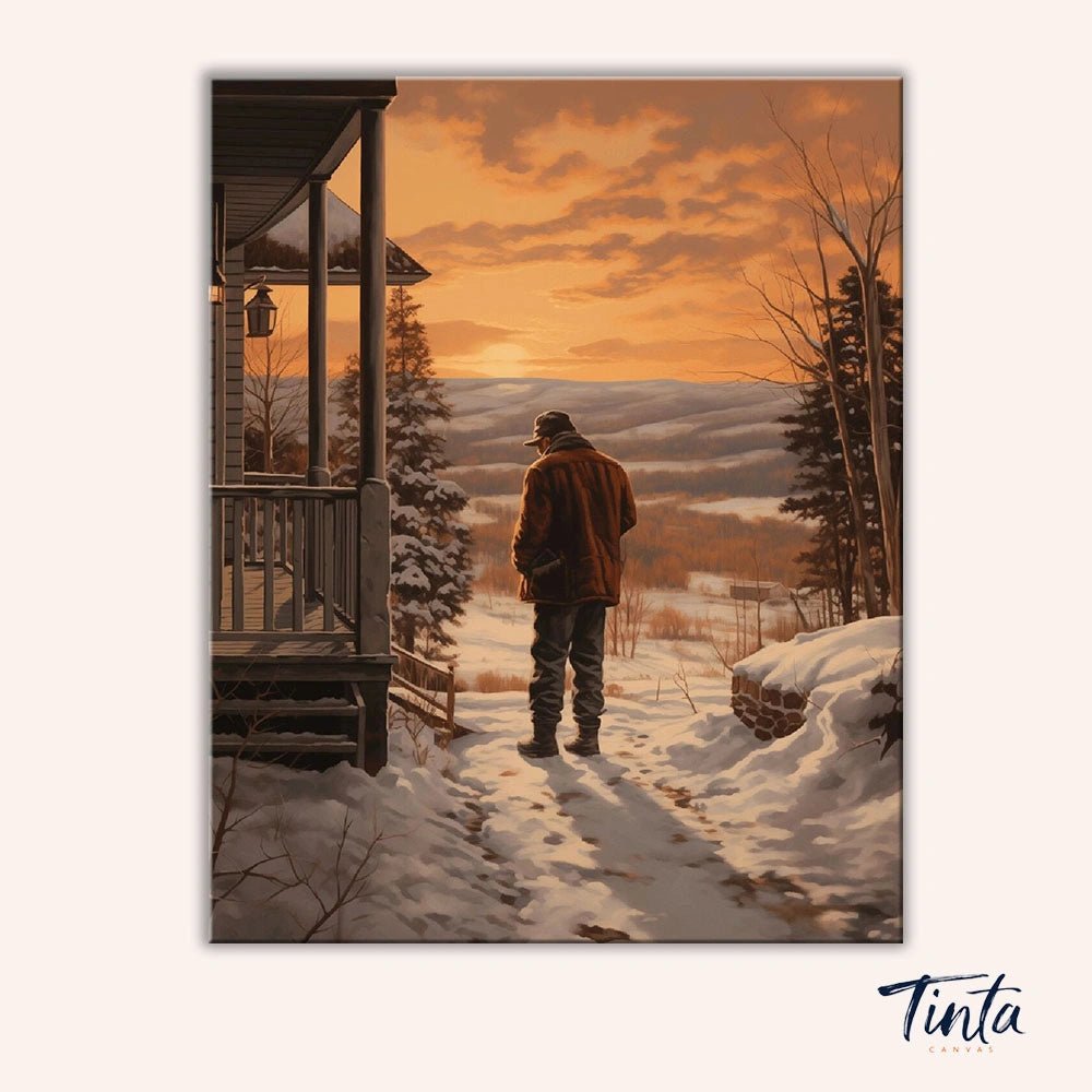 Hearthside Horizon paint by numbers kit artwork featuring a man walking through snowy hills beside a cozy cabin at sunset by Tinta Canvas