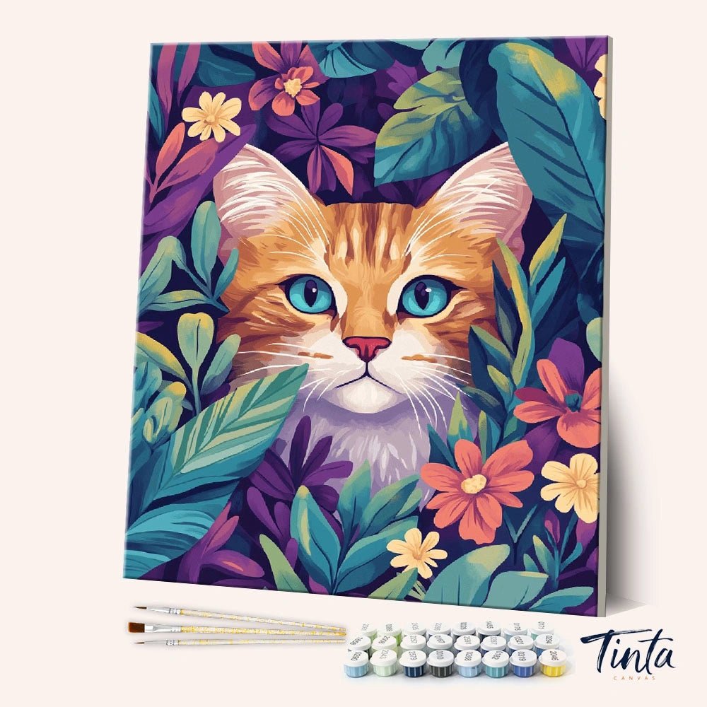 Angled view of Hidden Kitty paint by numbers kit featuring orange cat with blue eyes in floral leaves by Tinta Canvas