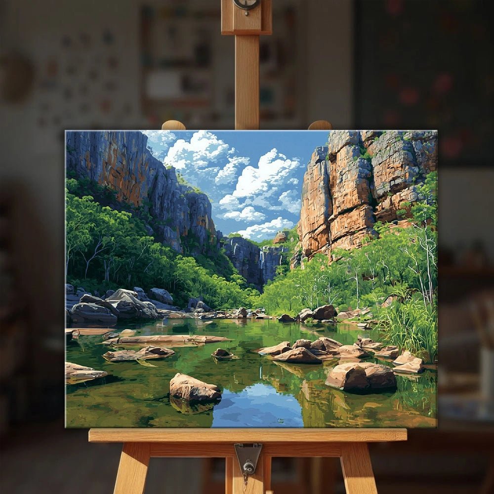 Kakadu National Park paint by numbers kit displayed on easel with scenic gorge and lush greenery by Tinta Canvas