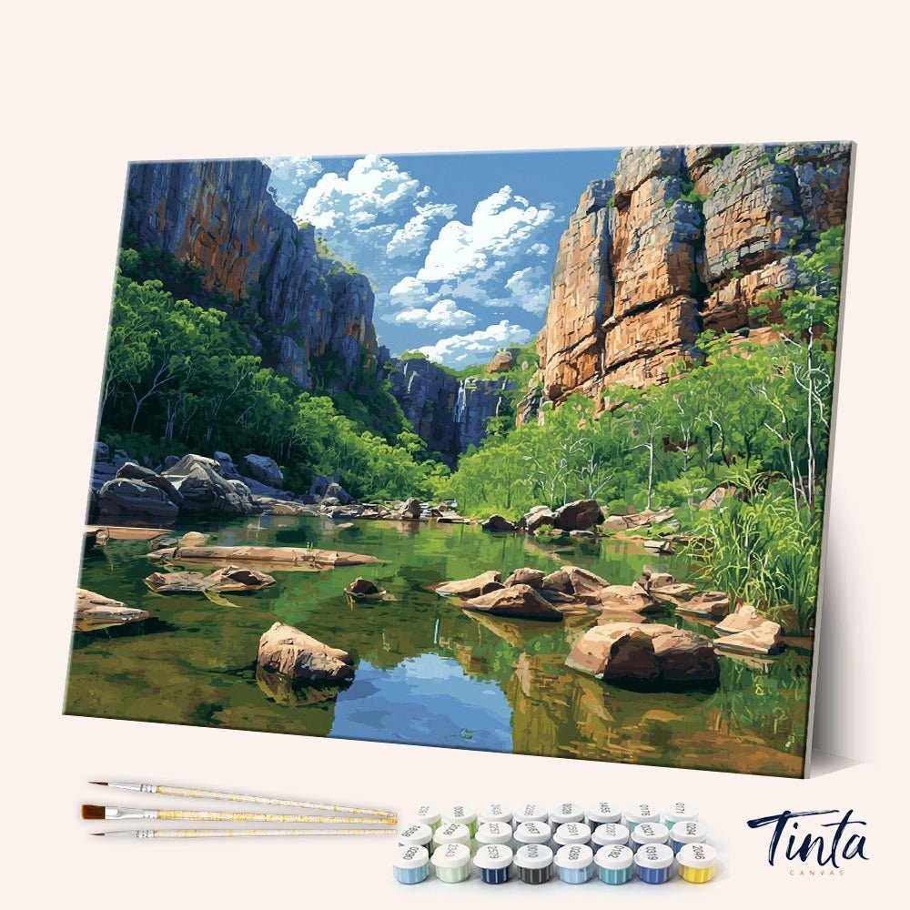 Angled view of Kakadu National Park paint by numbers kit showing rocky cliffs and calm river landscape by Tinta Canvas