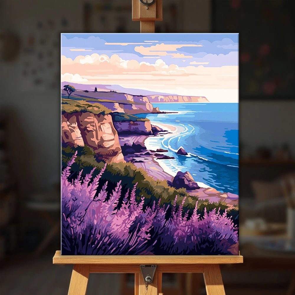 Lavender Coastline Calm paint by numbers kit displayed on easel in a cozy interior setting by Tinta Canvas