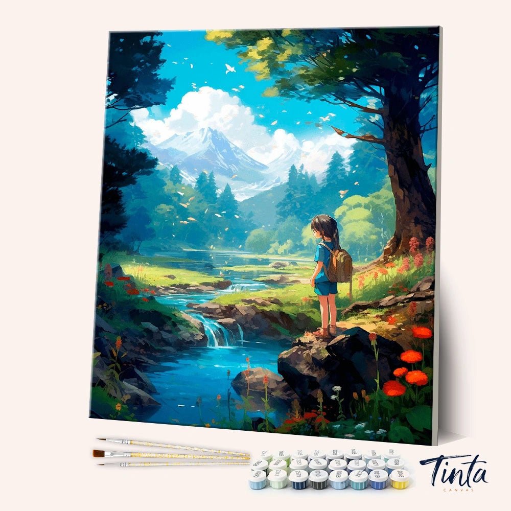 Angled display of the Little Explorer paint by numbers kit showing a young adventurer by a forest stream with brushes and paints by Tinta Canvas