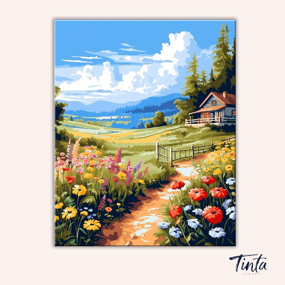 Clean artwork of the Meadow Cottage paint by numbers kit featuring a countryside path leading to a cottage with colorful wildflowers by Tinta Canvas