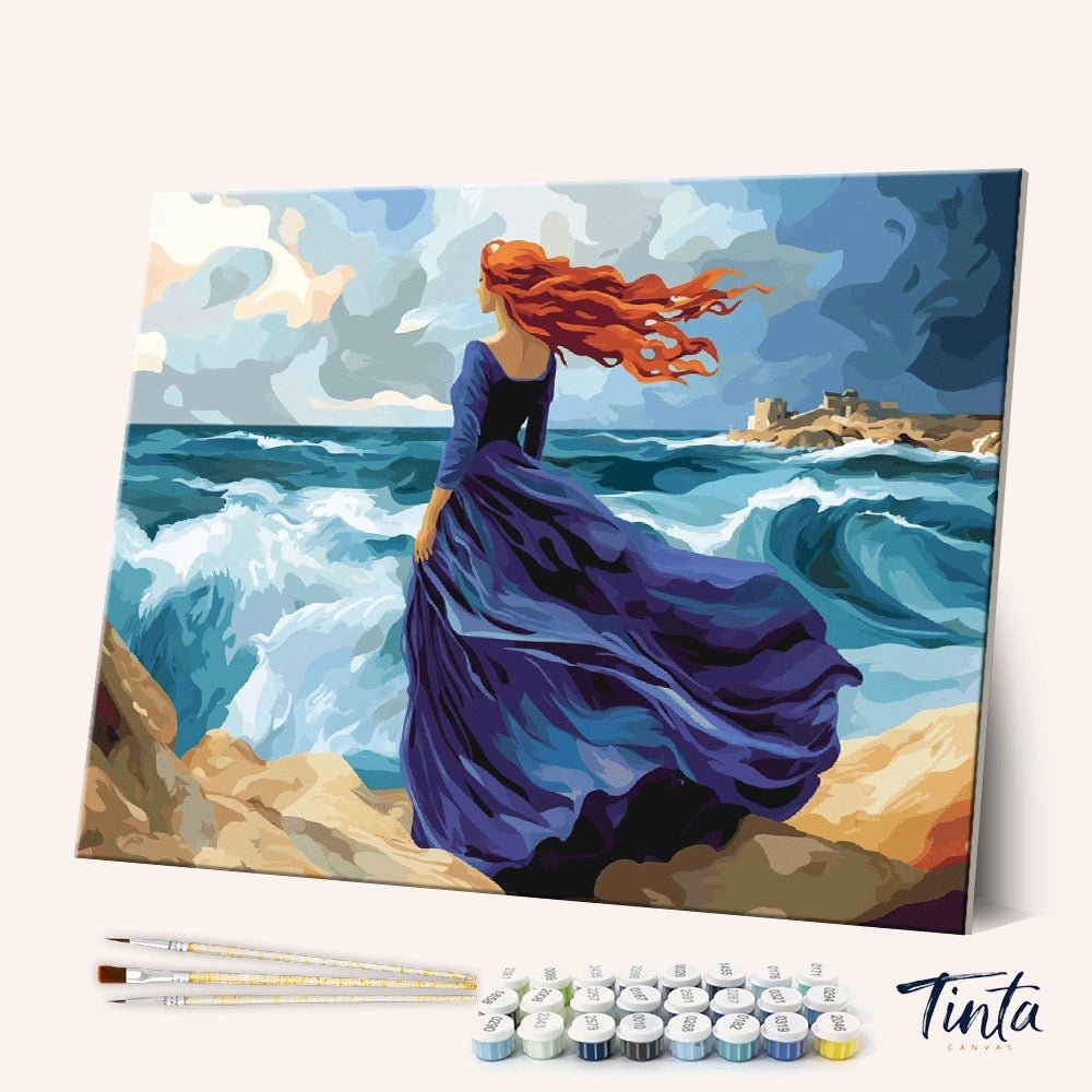 Angled display of the Miranda - The Tempest paint by numbers kit showing dramatic ocean scene canvas with brushes and paints by Tinta Canvas