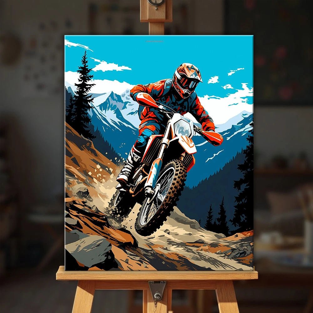Mountain Trail Rider paint by numbers kit displayed on an easel showing a motocross rider descending a rugged mountain path by Tinta Canvas
