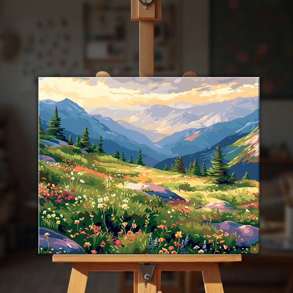 Mountain Wildflowers paint by numbers kit displayed on an easel showing vibrant wildflowers across a scenic mountain valley by Tinta Canvas