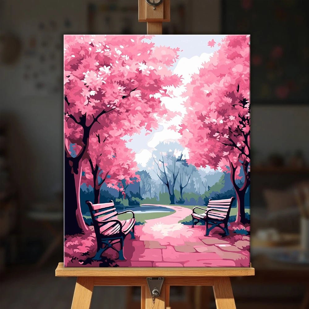 Pink Park paint by numbers kit displayed on easel in a cozy room setting showing finished artwork with soft decor ambiance by Tinta Canvas