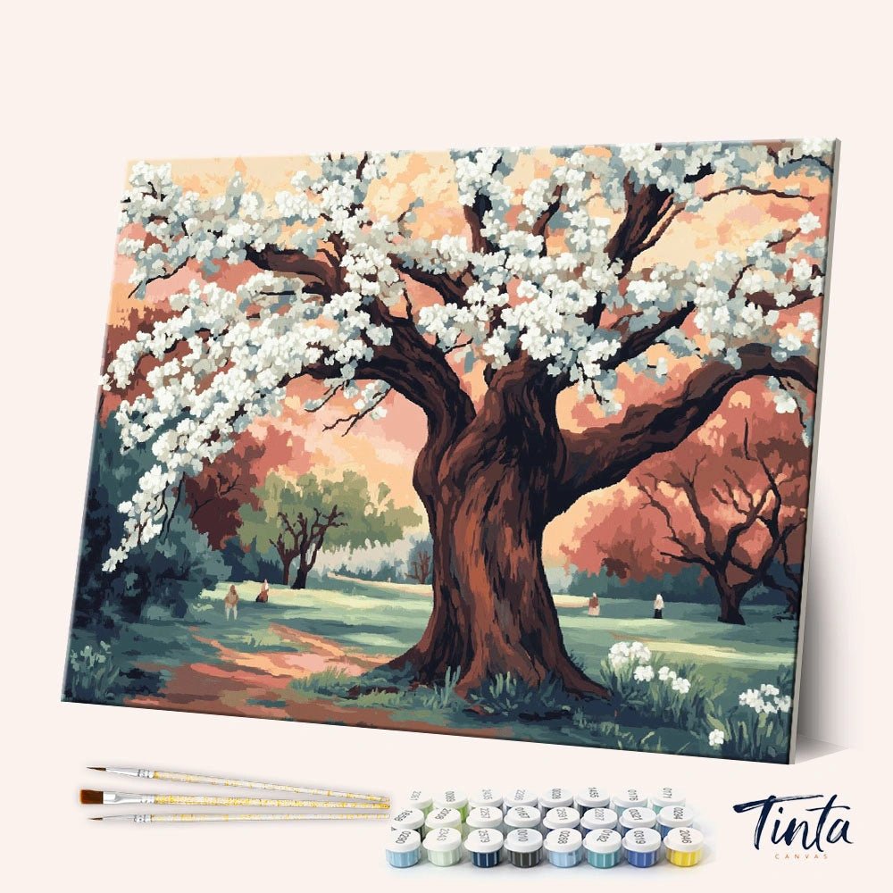 Angled view of Plum Garden paint by numbers kit showing blooming tree with white flowers in a serene park scene with tools included by Tinta Canvas