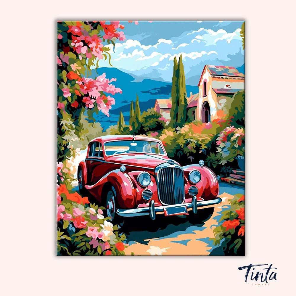 Clean artwork of Riviera Rose Drive paint by numbers kit showing classic red car beside Mediterranean villa and blooming roses by Tinta Canvas