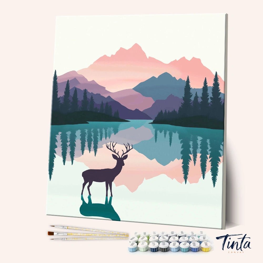 Angled view of Silent Lake Guardian paint by numbers kit featuring deer silhouette by reflective mountain lake at sunset by Tinta Canvas