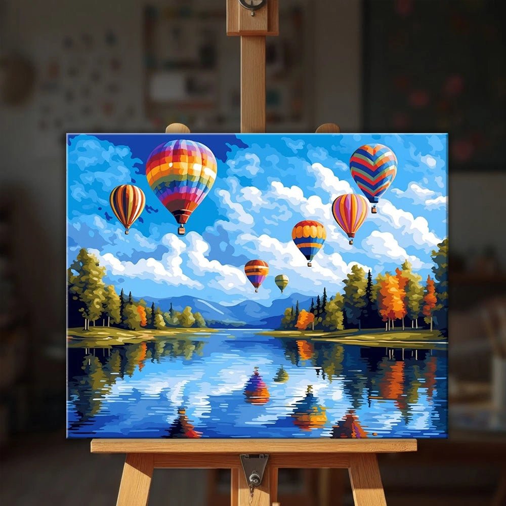 Skyward Reflections paint by numbers kit displayed on easel in bright room with scenic view by Tinta Canvas