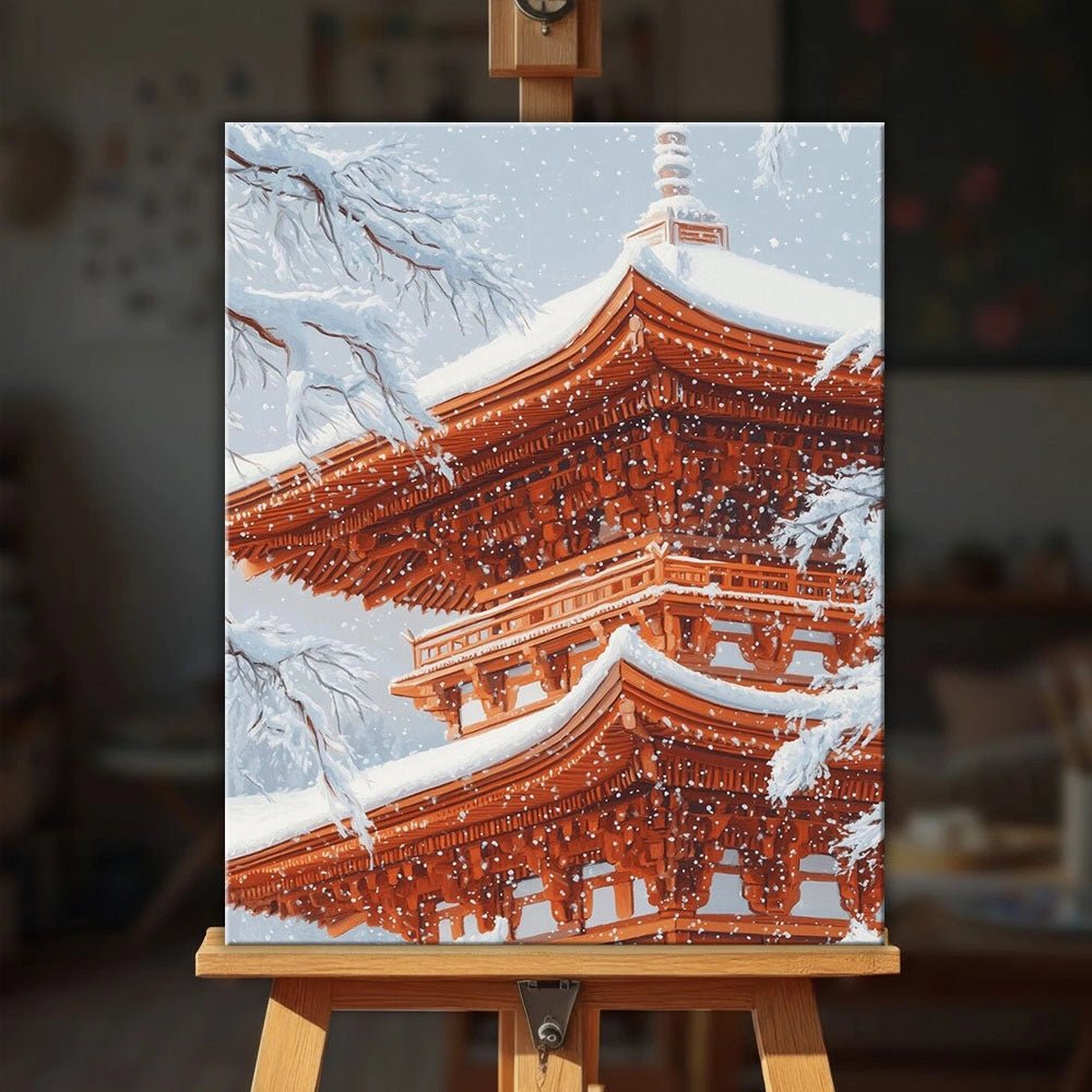 Snow Kissed Pagoda paint by numbers kit displayed on easel with serene snowy temple and calm atmosphere