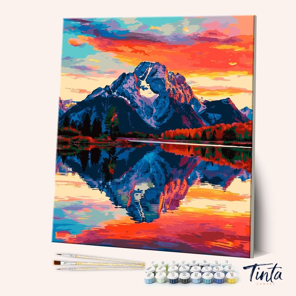 Angled canvas view of Still as the Mountain paint by numbers kit showing vibrant sunset mountain reflection by Tinta Canvas