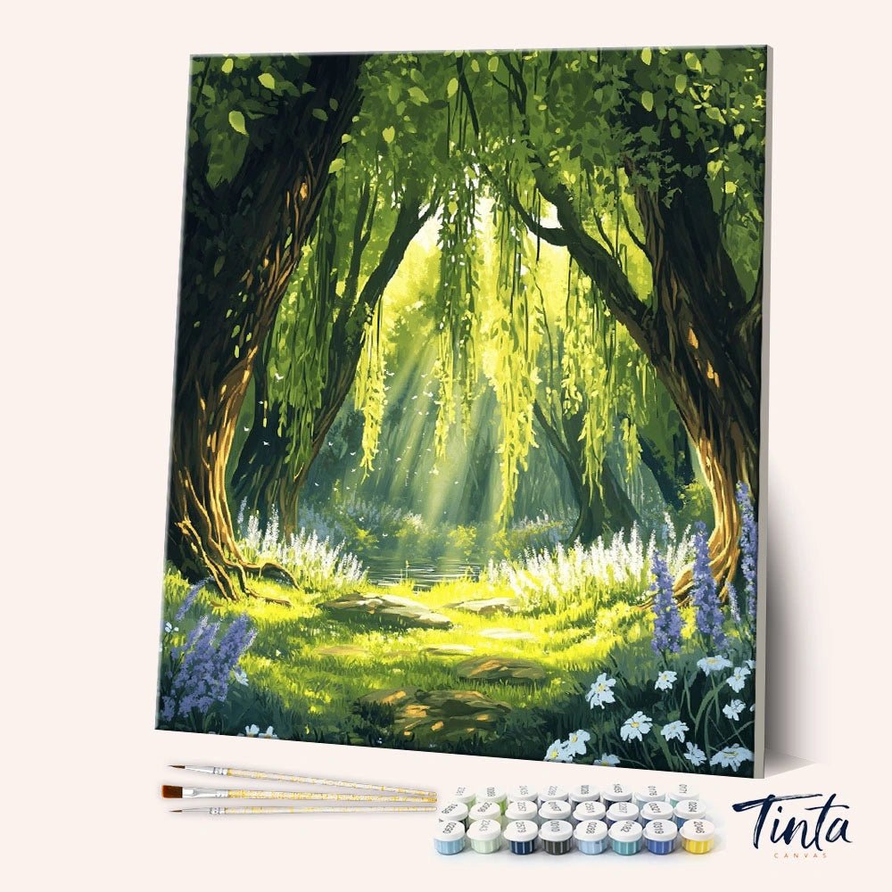 Angled view of Sunlit Grove paint by numbers kit showing forest trees and glowing sun rays by Tinta Canvas