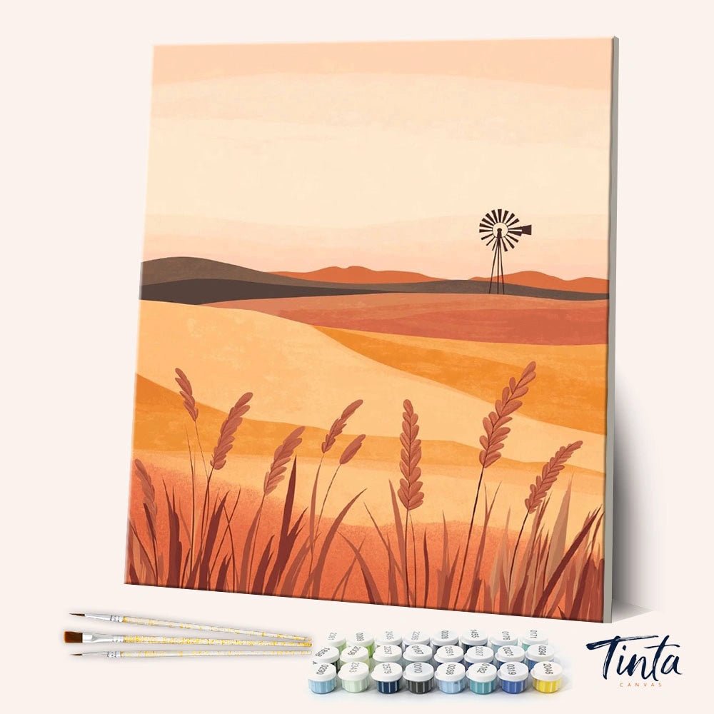 Wheat Field paint by numbers kit shown in angled view with golden crops, rolling hills, and soft sunset tones