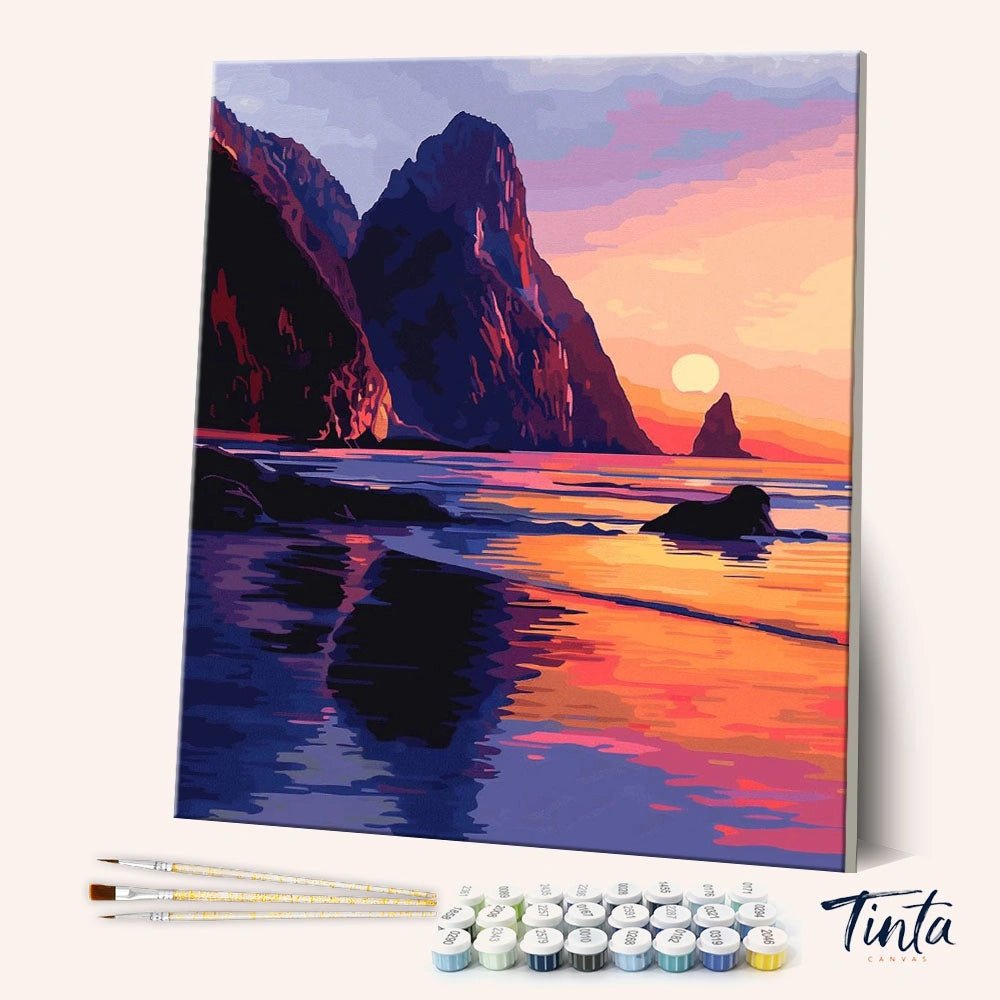 Where Land Meets Sea paint by numbers kit shown in angled view with cliffs, ocean reflections, and sunset sky