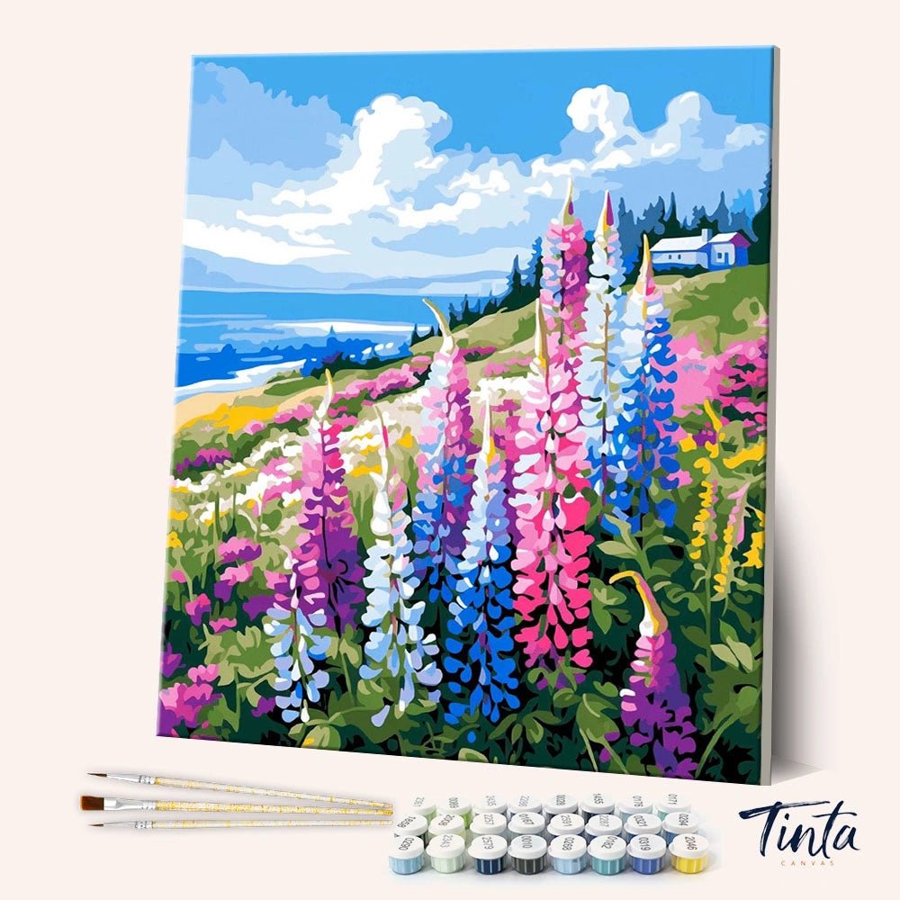 Wildflower Coastal Bluff paint by numbers kit shown in angled view with colorful flowers and ocean backdrop