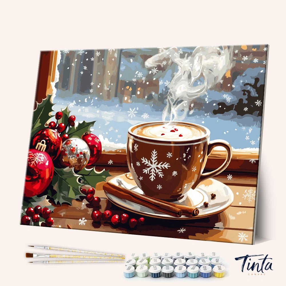 Winter Break paint by numbers kit shown in angled view with warm drink, snow outside window, and festive decor