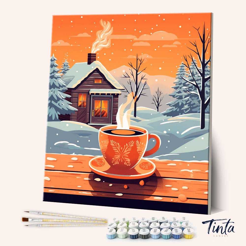Winter Coffee Retreat paint by numbers kit shown in angled view with steaming cup and snowy cabin scene