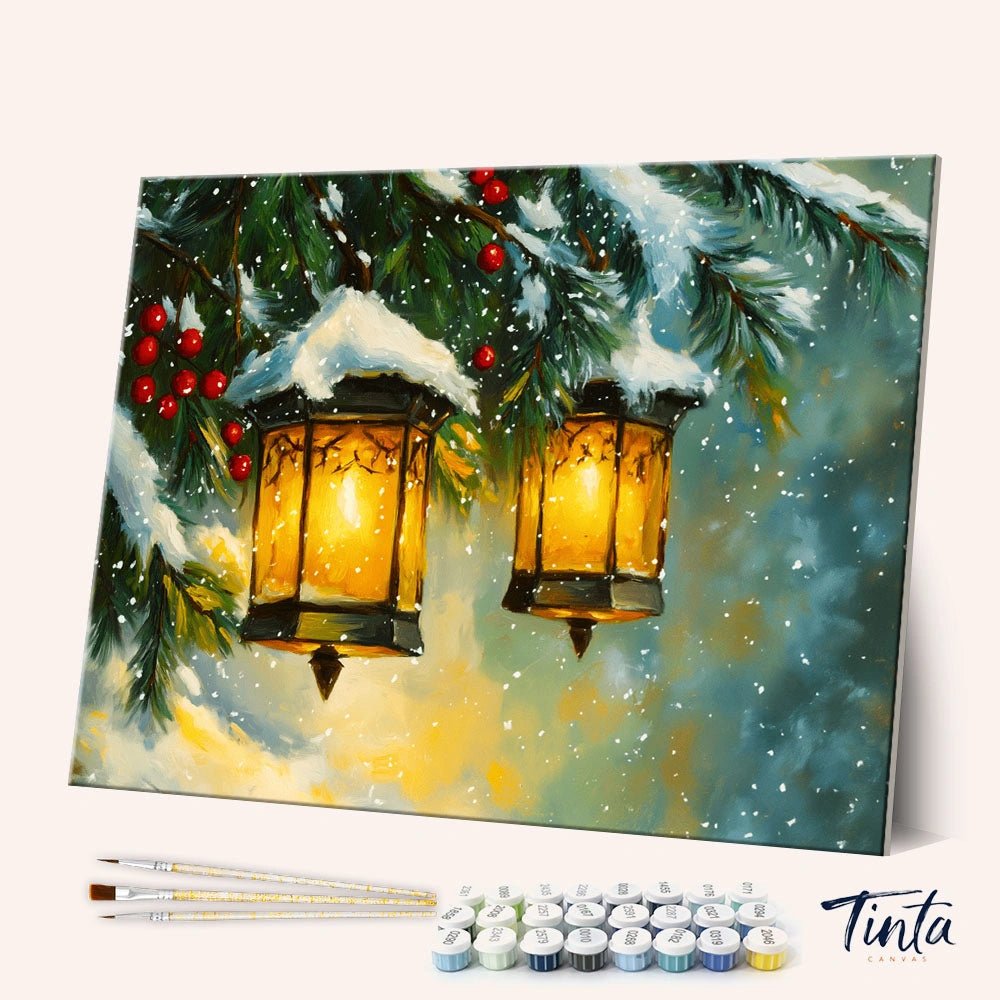 Winter Lanterns paint by numbers kit angled view showing glowing lanterns under snowy pine branches with red berries